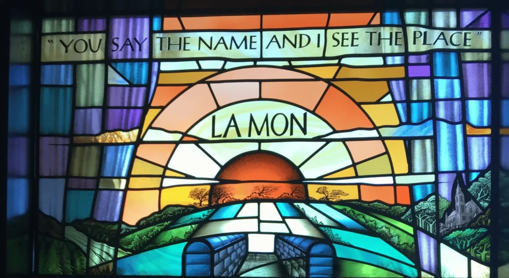 Stained Glass Church Window with the words "You say the name and I see the place"
